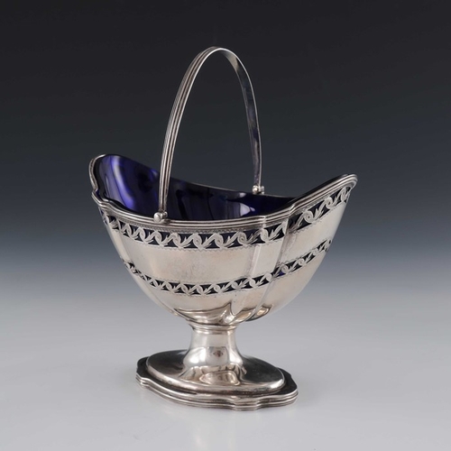 100 - A George III silver reticulated sugar basket, Hester Bateman, London 1787, bright cut pedestal boat ... 