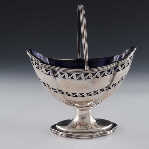 100 - A George III silver reticulated sugar basket, Hester Bateman, London 1787, bright cut pedestal boat ... 