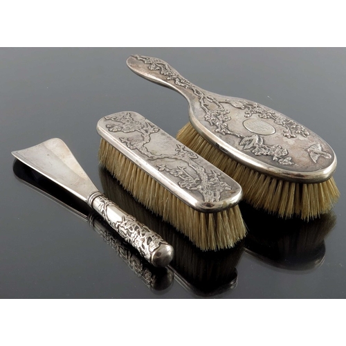 13 - A Chinese silver three piece brush and shoe horn set, Tuck Chang, Shanghai circa 1910, embossed with... 