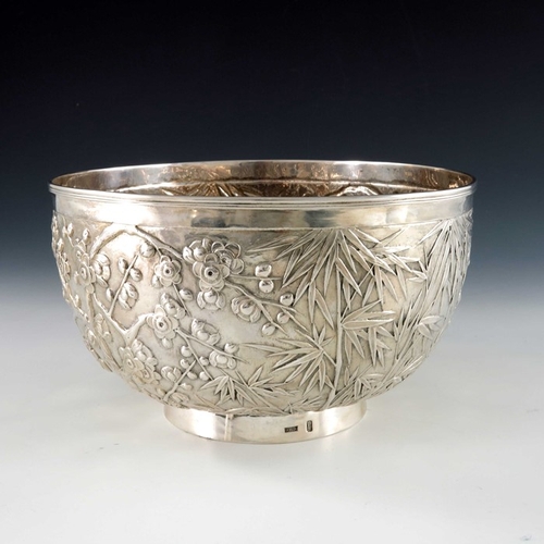 16 - A Chinese export silver bowl, Wang Hing, circa 1900, rounded and footed, embossed and chased in reli... 