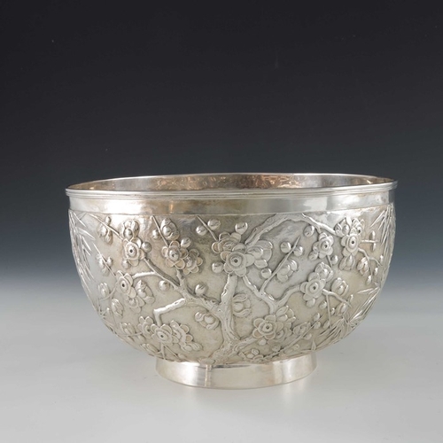 16 - A Chinese export silver bowl, Wang Hing, circa 1900, rounded and footed, embossed and chased in reli... 