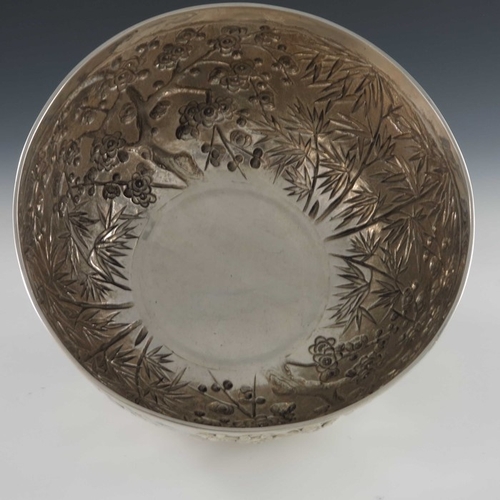 16 - A Chinese export silver bowl, Wang Hing, circa 1900, rounded and footed, embossed and chased in reli... 