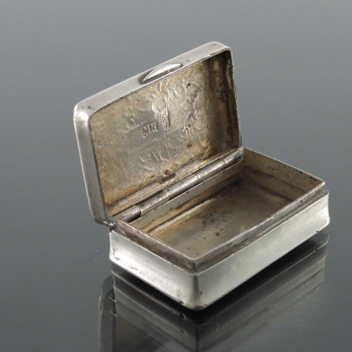 18 - A Chinese export silver snuff box, MK, Canton circa 1870, waisted cuboid form with chased floral gar... 