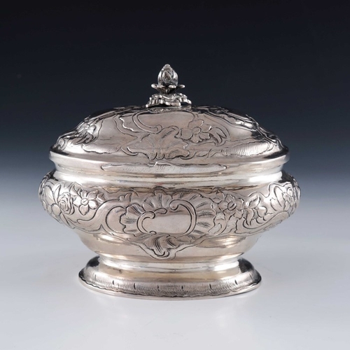 21 - An 18th century Baltic silver sugar box, WM, probably Tallinn circa 1750, oval ogee bombe form, embo... 