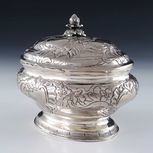 21 - An 18th century Baltic silver sugar box, WM, probably Tallinn circa 1750, oval ogee bombe form, embo... 