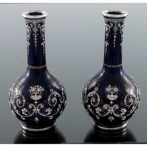 26 - A pair of French silver and enamelled miniature vases, circa 1880, globe and shaft form, blue ground... 