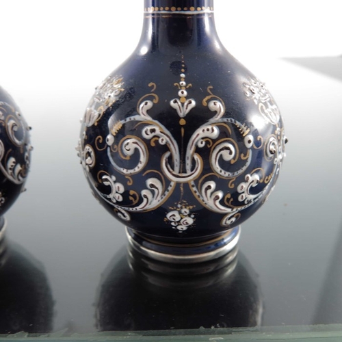 26 - A pair of French silver and enamelled miniature vases, circa 1880, globe and shaft form, blue ground... 