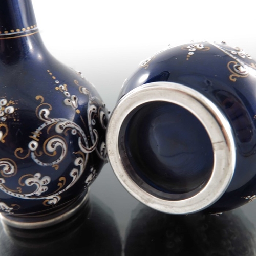 26 - A pair of French silver and enamelled miniature vases, circa 1880, globe and shaft form, blue ground... 