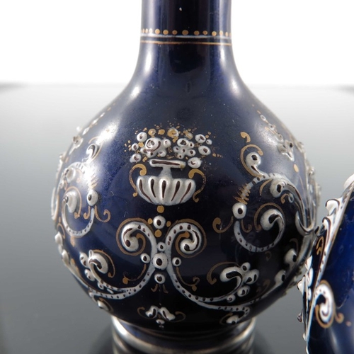 26 - A pair of French silver and enamelled miniature vases, circa 1880, globe and shaft form, blue ground... 