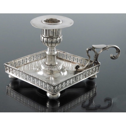 27 - A Portuguese silver chamberstick, Porto 19th Century, of Neoclassical form, lozenge form with reticu... 