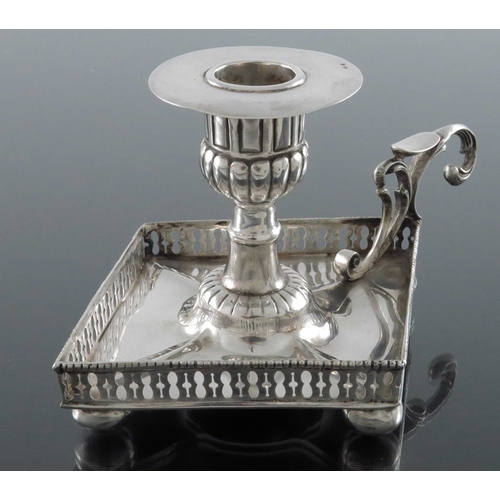 27 - A Portuguese silver chamberstick, Porto 19th Century, of Neoclassical form, lozenge form with reticu... 