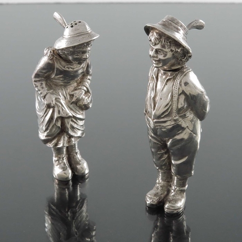 34 - A pair of Continental cast silver novelty salt and pepper pots, probably German, modelled as Kate Gr... 