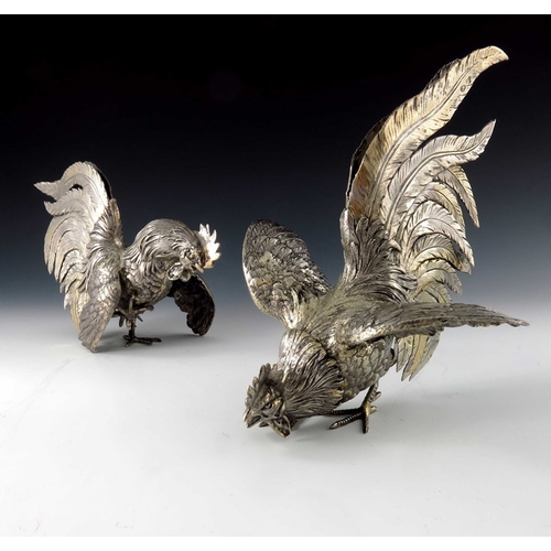 37 - A pair of Italian silver gilt cockerel figures, ML, cast and chased realistically, modelled fighting... 