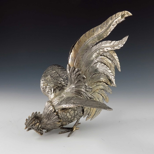 37 - A pair of Italian silver gilt cockerel figures, ML, cast and chased realistically, modelled fighting... 