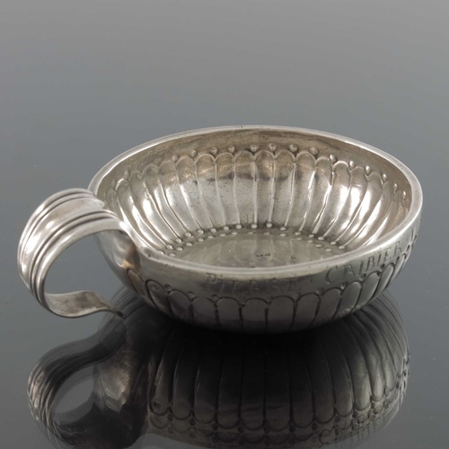 43 - A Louis XV French silver wine taster, IF, Orleans 1774,  the incised reeded body with beaded border,... 