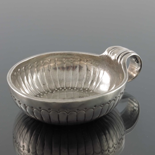 43 - A Louis XV French silver wine taster, IF, Orleans 1774,  the incised reeded body with beaded border,... 