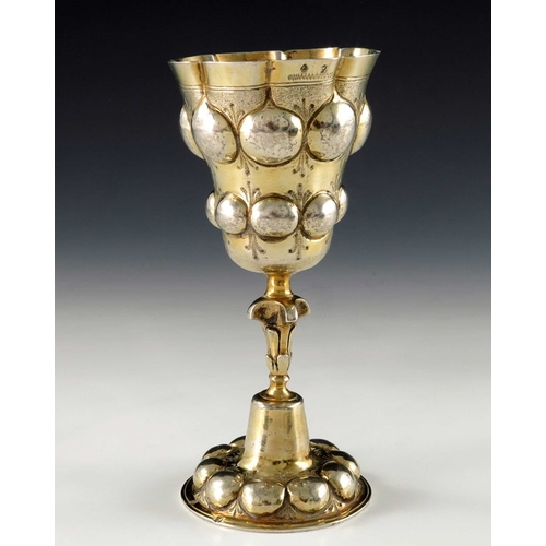 45 - A 17th century German silver gilt chalice cup, H.D.S., Augsburg circa 1620, the ogee bowl embossed i... 