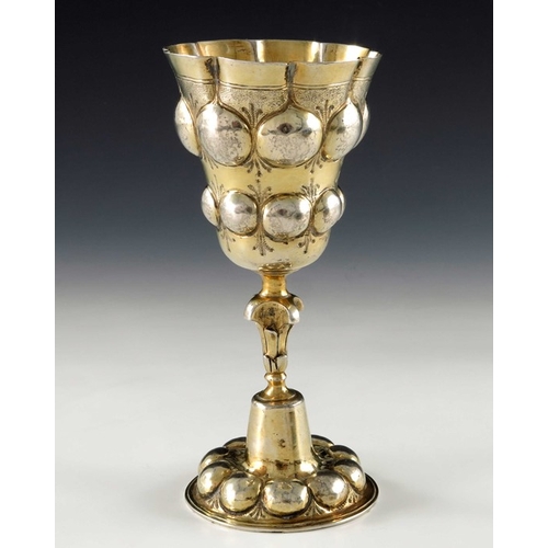 45 - A 17th century German silver gilt chalice cup, H.D.S., Augsburg circa 1620, the ogee bowl embossed i... 