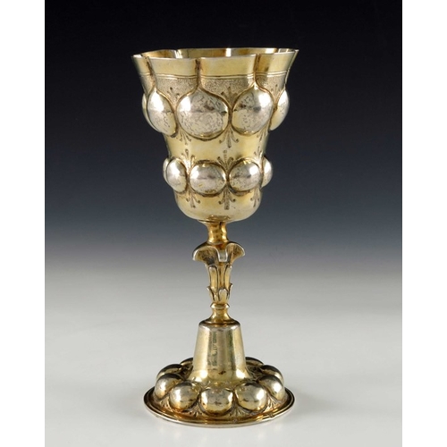 45 - A 17th century German silver gilt chalice cup, H.D.S., Augsburg circa 1620, the ogee bowl embossed i... 