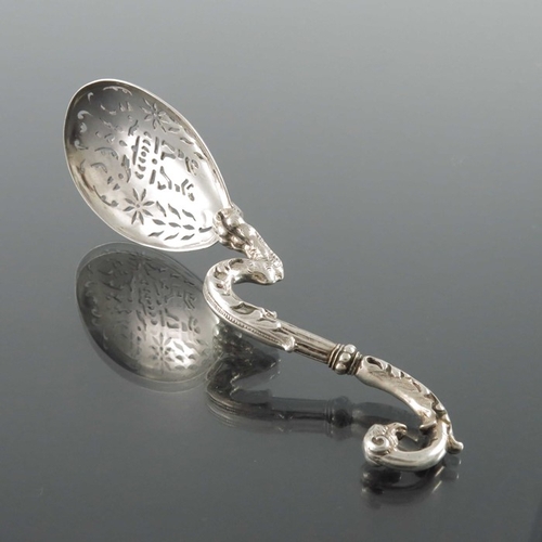 58 - A Dutch silver sifter spoon, the pierced bowl on a cast zoomorphic foliate griffin stem, 14cm long, ... 