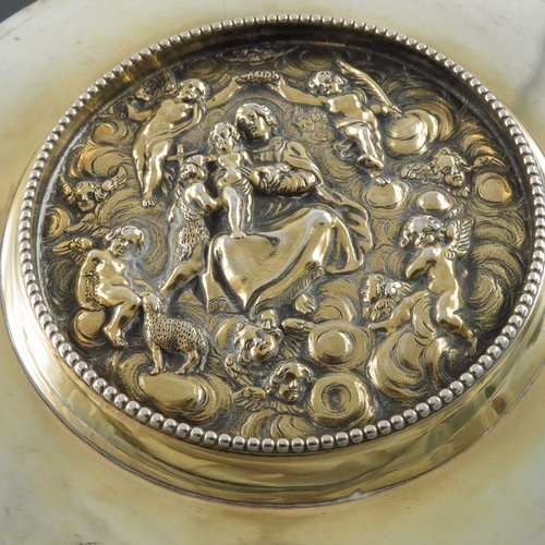 60 - A French Napoleonic silver and parcel gilt paten, QB, circa 1810, the top of plain broad rimmed form... 