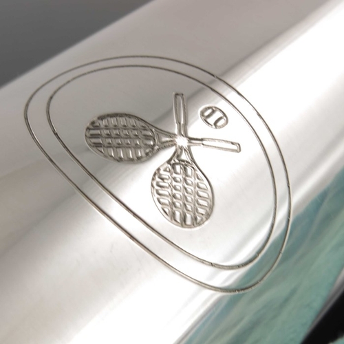 62 - A silver tennis ball tube, Tiffany and Co., import marks London 1997, cylindrical form etched with c... 