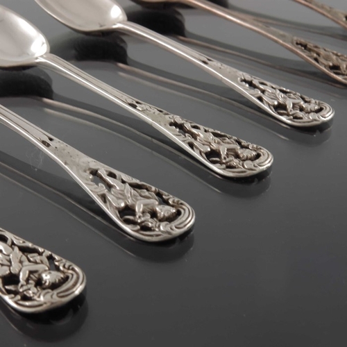 85 - A set of six Victorian  silver reticulated picture front and scroll back teaspoons, Francis Higgins,... 