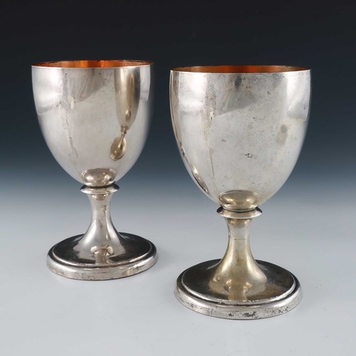 97 - A pair of George III Old Sheffield Plate goblets, circa 1790, pedestal ovoid form, on waisted and sp... 