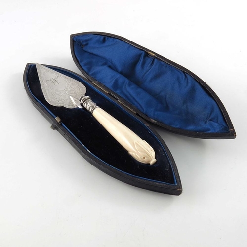 102 - A Victorian silver plated and carved ivory handled butter trowel, circa 1880, the blade engraved wit... 