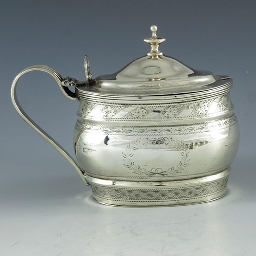 107 - Nathan and Hayes, Chester 1905, an Edwardian silver mustard pot, ogee moulded oval form, bright cut ... 