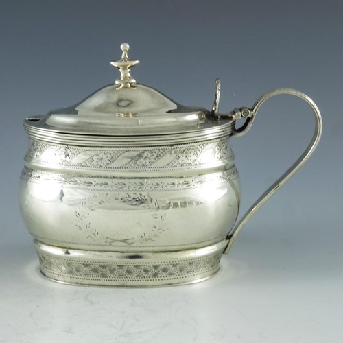 107 - Nathan and Hayes, Chester 1905, an Edwardian silver mustard pot, ogee moulded oval form, bright cut ... 