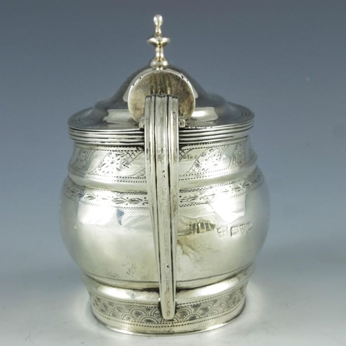 107 - Nathan and Hayes, Chester 1905, an Edwardian silver mustard pot, ogee moulded oval form, bright cut ... 