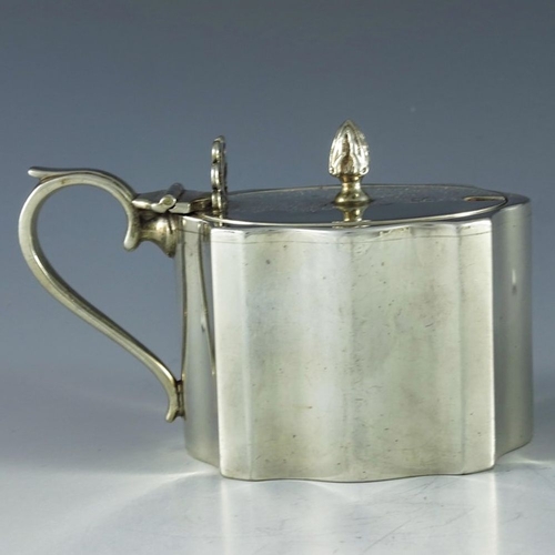 108 - Charles Perry and Co., Chester 1930, a George V silver mustard pot, straight sided ogee fluted recta... 