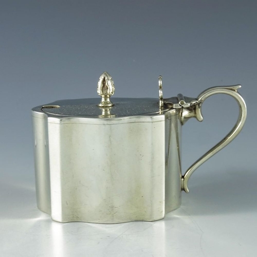 108 - Charles Perry and Co., Chester 1930, a George V silver mustard pot, straight sided ogee fluted recta... 