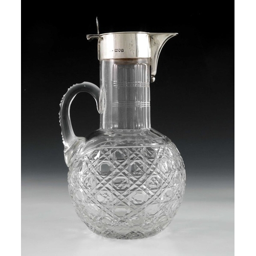 120 - A George V silver mounted cut glass claret jug, Robert Pringle, London 1914, the globe body with hob... 