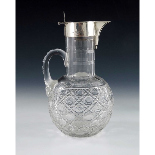 120 - A George V silver mounted cut glass claret jug, Robert Pringle, London 1914, the globe body with hob... 