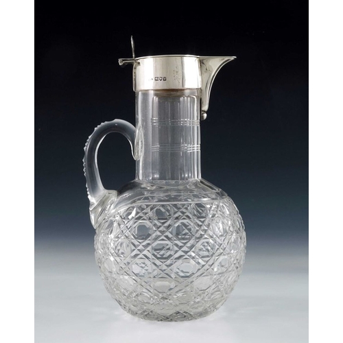 120 - A George V silver mounted cut glass claret jug, Robert Pringle, London 1914, the globe body with hob... 