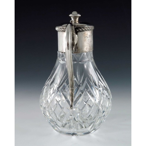 121 - An Elizabeth II silver mounted cut glass claret jug, F G Flavell, Birmingham 1979, the bulbous body ... 