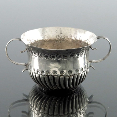 124 - A Queen Anne miniature silver porringer, Benjamin Bentley, London circa 1705, twin handled ogee form... 