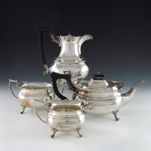 128 - A George V silver four piece tea set, Cooper Brothers and Sons, Sheffield 1920/21, stepped boat form... 