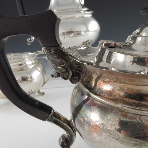 128 - A George V silver four piece tea set, Cooper Brothers and Sons, Sheffield 1920/21, stepped boat form... 