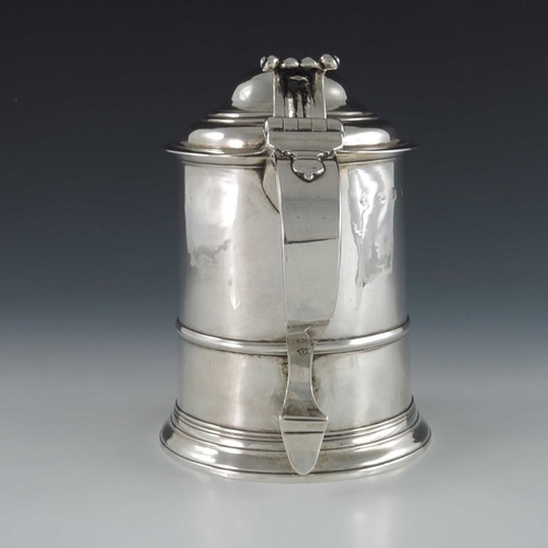 129 - A George II silver lidded tankard, Sarah Parr, London 1732, banded cylindrical form on stepped foot,... 