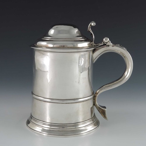 129 - A George II silver lidded tankard, Sarah Parr, London 1732, banded cylindrical form on stepped foot,... 