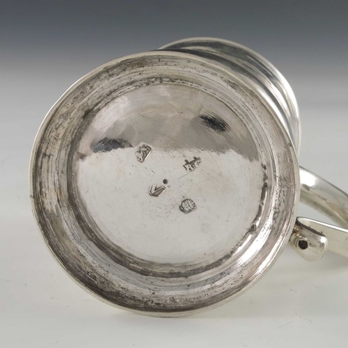 130 - A George II silver mug, Richard Gosling, London 1735, baluster form, on stepped foot, with S scroll ... 