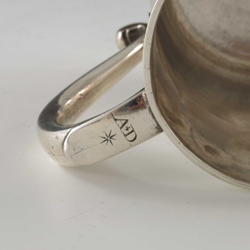 130 - A George II silver mug, Richard Gosling, London 1735, baluster form, on stepped foot, with S scroll ... 