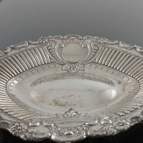 139 - A Victorian silver dish, Sheffield 1886, oval form with embossed foliate scroll and floral rim and r... 