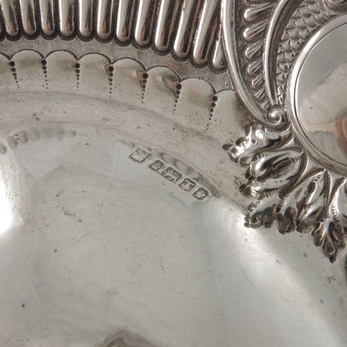 139 - A Victorian silver dish, Sheffield 1886, oval form with embossed foliate scroll and floral rim and r... 