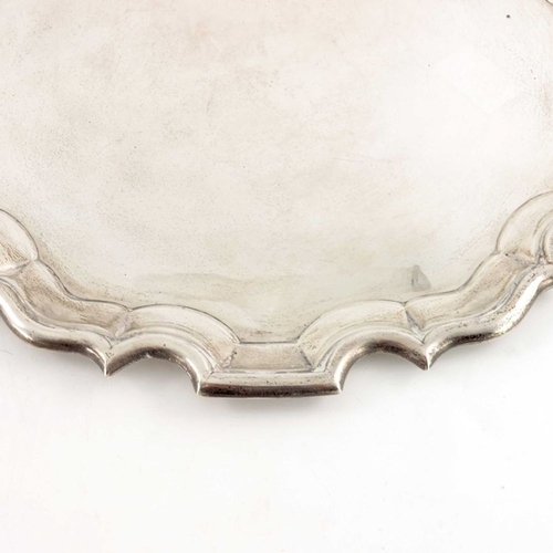 144 - An Edwardian silver tray, Mappin and Webb, London 1908, circular with ogee rounded and fluted border... 