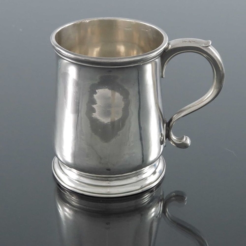 145 - A George II silver mug, Richard Burcombe, London 1731, plain cylindrical baluster form, on stepped o... 