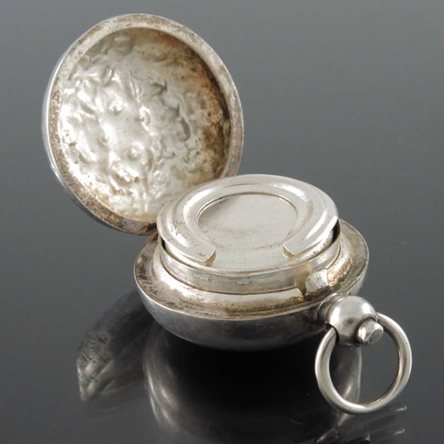 148 - An Edwardian silver sovereign case, Birmingham 1907, together with an Indian white metal example, ea... 